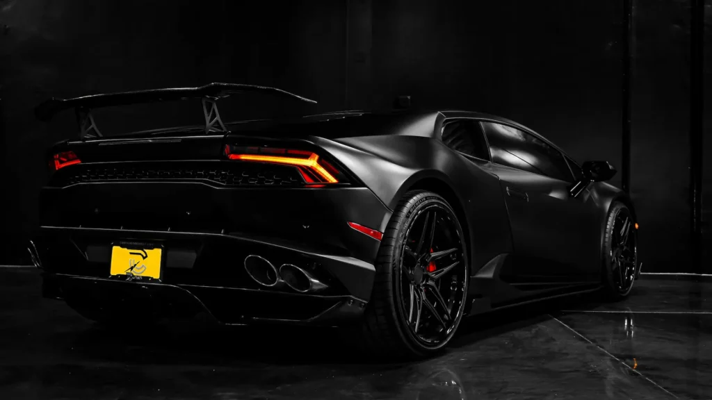 Close-up of exotic car detailing on a matte black Aventador by Neighbors Mobile Detailer.