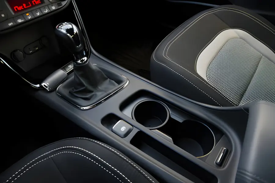 Interior car detailing on a clean center console by Neighbors Mobile Detailer in Austin, TX.